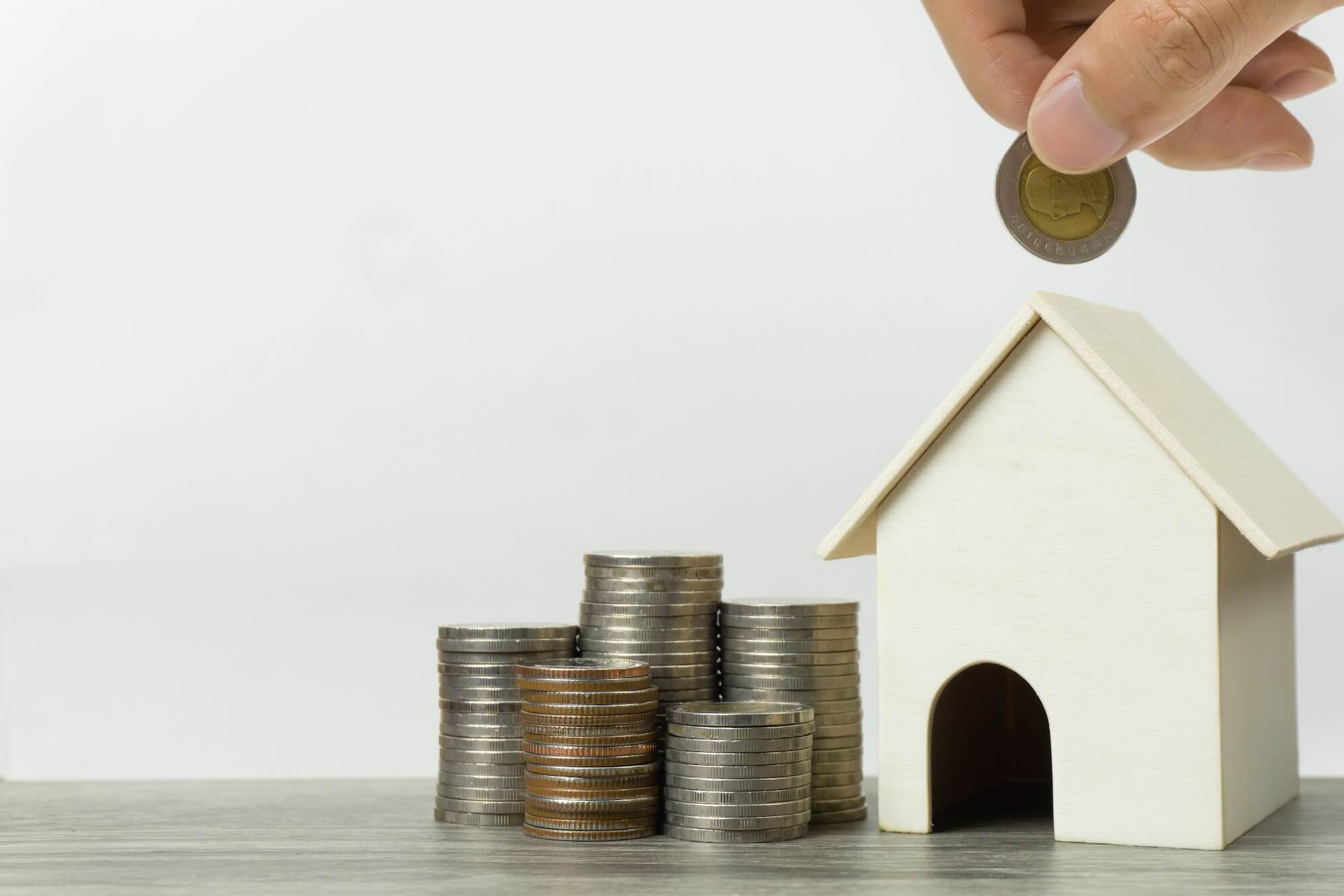 Saving money, home loan, mortgage, a property investment for future concept